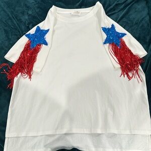 Relaxed fit white t-shirt with blue sequin star detail and red fringe sequins.